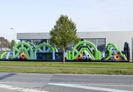 Buy a 30 meter mega obstacle course in the colors black and green for both young and old. Order inflatable obstacle courses now online at JB Inflatables America