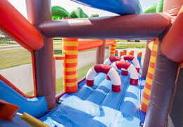 Buy shark-themed inflatable obstacle course with 7 game elements and colorful objects for children. Order inflatable obstacle courses now online at JB Inflatables America