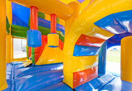 Medium inflatable clown themed bouncer with slide and pillars on the jumping surface, buy for children. Order inflatable bouncers online at JB Inflatables America