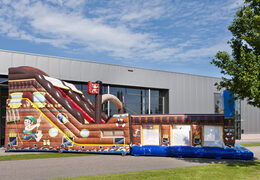 Mega inflatable slide in Pirates world theme with 3D obstacles for children. Buy inflatable slides now online at JB Inflatables America