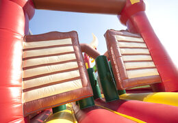 Order an inflatable 17 meter wide obstacle course in a cowboy theme with 7 game elements and colorful objects for kids. Buy inflatable obstacle courses online now at JB Inflatables America