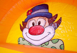 Spectacular inflatable slide in clown theme with cheerful colors for children. Buy inflatable slides now online at JB Inflatables America