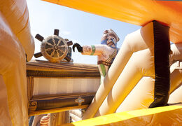 Spectacular inflatable slide in a striking pirate ship shape with cool 3D objects and full color prints for children. Buy inflatable slides now online at JB Inflatables America