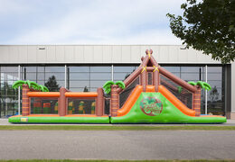 Order a 17 meter wide unique jungle themed obstacle course with 7 game elements and colorful objects for children. Buy inflatable obstacle courses online now at JB Inflatables America