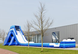 Monsterslide 11 meters high and 53 meters long with a double staircase and wide slide. Order inflatable slides now online at JB Inflatables America