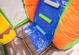 Multiplay Dinoworld bounce house with a slide, fun objects on the jumping surface and striking 3D objects for kids. Buy inflatable bounce houses online at JB Inflatables America