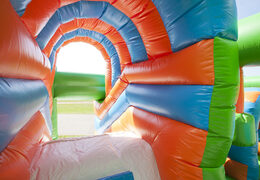 Buy a medium inflatable multiplay bounce house in football theme with slide for children. Order inflatable bounce houses online at JB Inflatables America