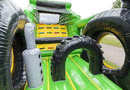 Unique 17 meter wide obstacle course in tractor theme with 7 game elements and colorful objects for kids. Buy inflatable obstacle courses online now at JB Inflatables America