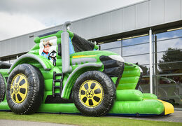 Order a 17 meter wide unique tractor themed obstacle course with 7 game elements and colorful objects for children. Buy inflatable obstacle courses online now at JB Inflatables America