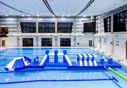 Slide swimming pool adventure run blue/white 16m with challenging obstacle objects and round slide for both young and old. Buy inflatable water attractions online now at JB Inflatables America