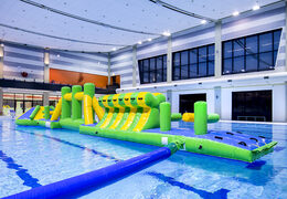 Adventure run green/blue 16m inflatable swimming pool with challenging obstacle objects and round slide for both young and old. Order inflatable pool games now online at JB Inflatables America