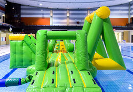 Order an airtight inflatable play island in a crocodile theme with a vine, climbing tower, round slide and obstacles for both young and old. Buy inflatable pool games now online at JB Inflatables America