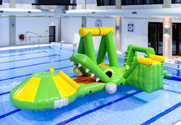 Order an inflatable airtight crocodile play island with a vine, climbing tower, round slide and obstacles for both young and old. Buy inflatable water attractions online now at JB Inflatables America