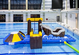 Get an airtight inflatable pirate play island with a vine, climbing tower, round slide and obstacles for both young and old. Order inflatable pool games now online at JB Inflatables America