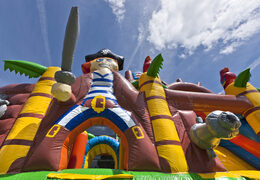 Buy mini inflatable pirate boat themed multiplay bounce house with slide for kids. Order inflatable bounce houses online at JB Inflatables America