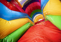 Buy a multiplay Lego bounce house with a slide, fun objects on the jumping surface and eye-catching 3D objects for kids. Order inflatable bounce houses online at JB Inflatables America