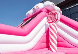 Candyworld themed inflatable bouncer with slides and fun printed obstacles for children. Buy bouncers online at JB Inflatables America