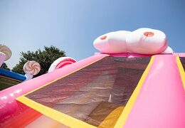 Candyworld bouncer with slides, obstacles with fun candy-themed prints for kids. Buy bouncers online at JB Inflatables America