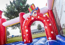Bounce World circus bouncer with slides and all kinds of obstacles with circus prints for kids. Order bouncers online at JB Inflatables America