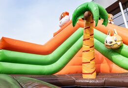Order an inflatable jungle bouncer with slides and fun obstacles with prints for children. Buy bouncers online at JB Inflatables America