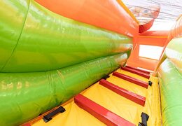 Jungle bouncer with slides, obstacles with fun jungle-themed prints for kids. Buy bouncers online at JB Inflatables America