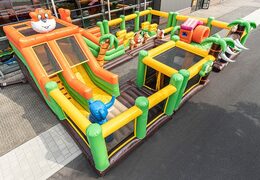 World jungle bounce house with multiple slides and all kinds of obstacles with prints that match the theme for kids. Buy bounce houses online at JB Inflatables America