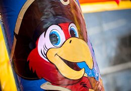 Multiplay indoor pirate bounce house with a slide for children. Orderbounce houses online at JB Inflatables America 