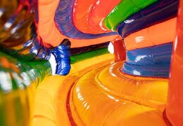 Circus themed inflatable crawl tunnel with obstacles, use a climbing ramp and slide for children. Buy bouncers online at JB Inflatables America 