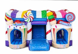 Multiplay XXL Candyland bounce house in a unique design with two entrances, a slide in the middle and 3D objects for kids. Buy bounce houses online at JB Inflatables America 