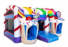 Candyland themed bounce house with a slide and 3D objects for children. Order bounce houses online at JB Inflatables America 