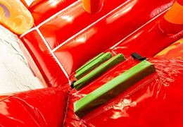 Indoor multiplay fire brigade bouncer in a unique design with two entrances, a slide in the middle and 3D objects for kids to order. Buy bouncers online at JB Inflatables America 