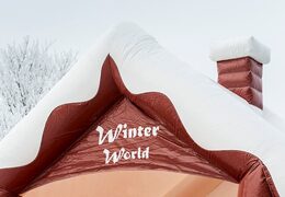 Skihut winterworld bounce house with a 3D chimney at the top for children. Bounce houses for sale online at JB Inflatables America
