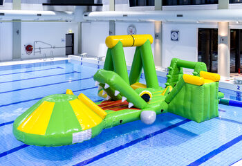 Order an inflatable airtight crocodile play island with a vine, climbing tower, round slide and obstacles for both young and old. Buy inflatable water attractions online now at JB Inflatables America