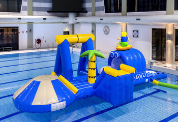 Unique airtight inflatable surfer play island with a vine, climbing tower, round slide and obstacles for both young and old. Buy inflatable pool games now online at JB Inflatables America