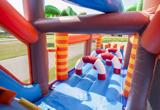 Buy shark-themed inflatable obstacle course with 7 game elements and colorful objects for children. Order inflatable obstacle courses now online at JB Inflatables America