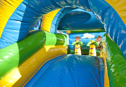 Buy indoor multifun bounce house with slide in jungle theme with a large 3D object of a gorilla on top for children. Order inflatable bounce houses online at JB Inflatables America