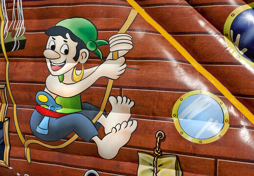 Buy an inflatable extra wide slide in the Pirates world theme with 3D obstacles for kids. Order inflatable slides now online at JB Inflatables America