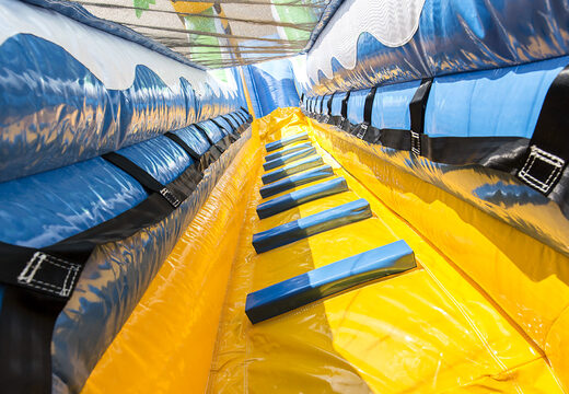 Get your inflatable crocodile slide with the cheerful colors and fun print on the back wall for children. Order inflatable slides now online at JB Inflatables America