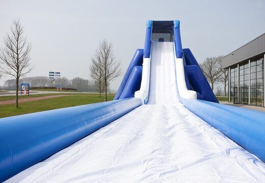 Monster slide inflatable 11 meters high and 53 meters long with a double staircase. Order inflatable slides now online at JB Inflatables America