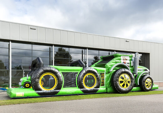 Order a unique 17 meter wide obstacle course in tractor theme for children. Buy inflatable obstacle courses online now at JB Inflatables America