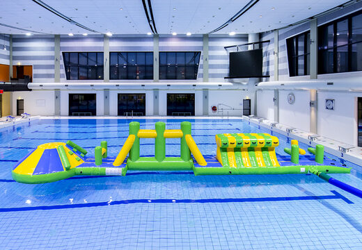 Slide swimming pool adventure run green/blue 16m with challenging obstacle objects and round slide for both young and old. Buy inflatable water attractions online now at JB Inflatables America