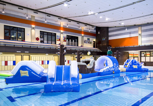 Inflatable double obstacle course 16 meter long pirate run swimming pool obstacle course in a unique design with funny 3D objects and no less than 2 slides for both young and old. Order inflatable pool obstacle courses now online at JB Inflatables America