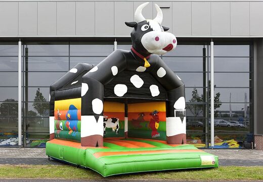 Order a standard bouncer in striking colors with a large 3D object of a cow on top for children. Order bouncers online at JB Inflatables America