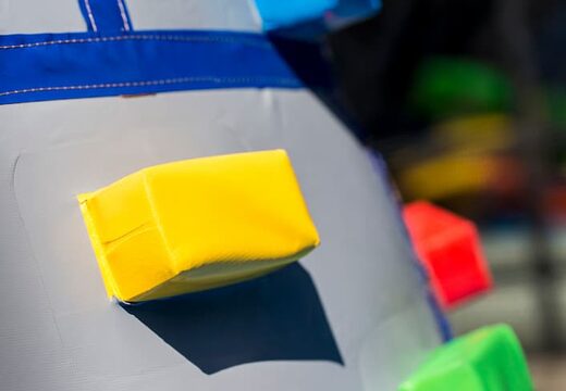 Inflatable covered bouncer in a castle theme with a slide on the jumping surface, climbing tower and fun obstacles for kids. Buy bouncers online at JB Inflatables America 