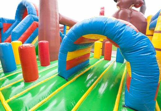 Inflatable multiplay pirate boat bounce house with a slide in the middle and 3D objects for kids. Order bounce houses online at JB Inflatables America 