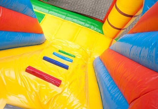 Bouncy castle in pirate boat theme with a slide and 3D objects for kids. Buy bouncy castles online at JB Inflatables America 