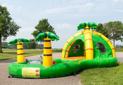 Buy a semi-open playzone jungle bouncy castle with plastic balls and 3D objects for children. Order bouncy castles online at JB Inflatables America 