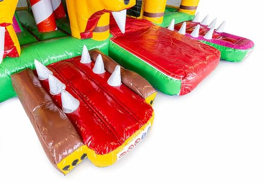 Indoor multiplay Jungleworld bounce house in a unique design with two entrances, a slide in the middle and 3D objects for kids. Buy bounce houses online at JB Inflatables America 