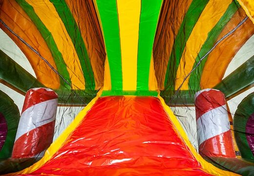 Multiplay XXL Jungleworld bounce house in a unique design with two entrances, a slide in the middle and 3D objects for children to order. Buy bounce houses online at JB Inflatables America 