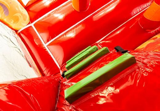 Indoor multiplay fire brigade bouncer in a unique design with two entrances, a slide in the middle and 3D objects for kids to order. Buy bouncers online at JB Inflatables America 